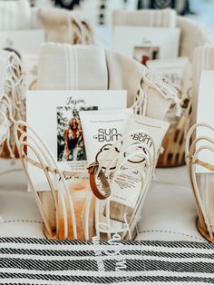 the table is set up with white linens and personal items for guests to use