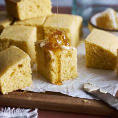 several pieces of cornbread with honey drizzled on top