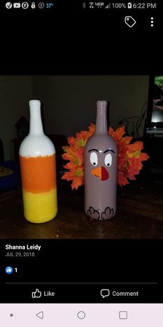 two wine bottles painted to look like turkeys