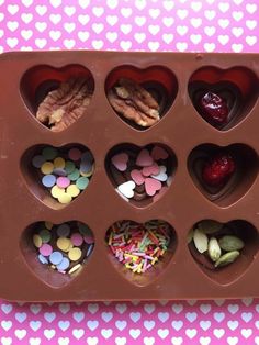 heart shaped chocolates are arranged in the shape of hearts