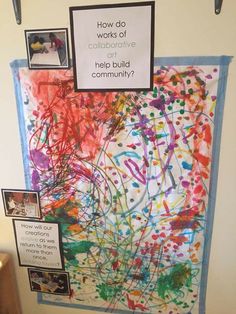 a bulletin board that has been decorated with colorful paint splatters and words on it