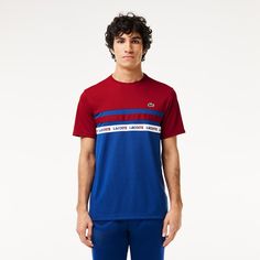 Men's Ultra-Dry Logo Stripe Piqué Tennis T-Shirt - Men's T-shirts - New In 2024 | Lacoste Sporty Blue Tennis Tops, Blue Sporty Tops For Tennis, Sporty Logo Top For Sports Events, Sporty Top With Logo For Sports Events, Short Sleeve Athleisure Tennis T-shirt, Athleisure Short Sleeve Tennis T-shirt, Cotton Sports Tops With Signature Stripes, Athleisure Tennis T-shirt With Graphic Print, Blue Short Sleeve Tennis Top