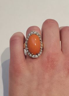 Vintage 14k Diamond Orange Coral Halo Cocktail Ring Total Size: 27.47 x 18.03 mm Coral Size: 21 x 13.48 mm 22 small diamonds Diamonds Total 0.75 Carate Ring Size: US 6 Weight 14.9 grams Orange Coral, Cocktail Ring, Cocktail Rings, Rings Statement, Statement Rings, Halo, Jewelry Rings, Ring Size, Coral