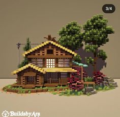 an image of a house made out of legos with trees and bushes around it