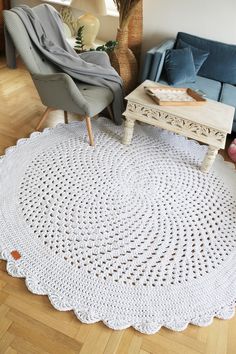 a white crocheted doily rug in a living room