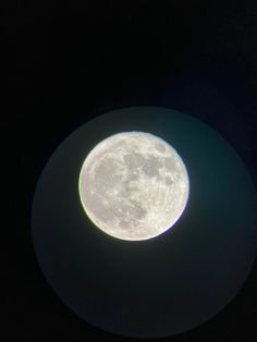 the full moon is visible in the dark sky