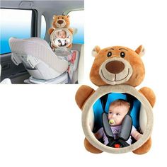 a teddy bear hanging from the side of a car seat with a baby in it