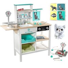 a toy kitchen with various items on the table and in it's display case