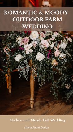 an outdoor farm wedding with flowers and greenery on the table, text romantic & moody outdoor farm wedding modern and mody fall wedding