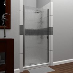 an image of a bathroom setting with shower stall and rugs on the wooden floor