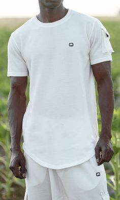 QL IGO Relaxed Cargo Shorts and T-Shirt Set in Cream Description: Picking summer outfits can be tough, QL IGO Relaxed Cargo Shorts and T-Shirt Set can become your best option for an effortless and stylish look. This fashion-forward set features a classic T-shirt designed with a pocket on the right shoulder that matches the cargo pockets on the cropped Sniper Cargo pants to give it a modern touch. It also offers a new ultra soft fabric making it very comfortable for running errands, having picnic Summer Athleisure T-shirt With Short Sleeves, Summer Athleisure Short Sleeve T-shirt, Summer Short Sleeve Athleisure T-shirt, Moisture-wicking Cotton T-shirt For Summer, Modern Islamic Clothing, Shorts Cargo, Cargo Pants Outfit, Islamic Clothing, Pants Outfit