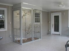 an empty living room with glass doors and windows