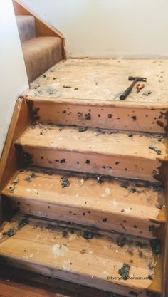 the stairs are covered with mold and wood chippings in preparation for paint job