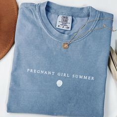 Pregnant Girl Summer Shirt, Comfort Colors Beach Pregnancy Announcement T-shirt, Pregnancy Reveal Tee, Baby Shower Gift, Mom Shirt ♥ DESCRIPTION: This is a Comfort Colors Unisex t-shirt that is 100% ring-spun cotton, soft-washed, garment-dyed fabric brings extra coziness to your wardrobe while the relaxed fit makes it an excellent daily choice. The double-needle stitching throughout the tee makes it highly durable while the lack of side-seams helps the shirt retain its tubular shape. ♥ BRAND: Co Summer Cotton Tops Bump Friendly, Maternity Graphic Tee With Crew Neck, Maternity Graphic T-shirt With Crew Neck, Maternity Graphic Tee With Letter Print, Bump Friendly Family Matching Cotton T-shirt, Maternity Tops With Letter Print And Short Sleeves, Maternity Short Sleeve Top With Letter Print, Bump Friendly Cotton Crew Neck Top, Maternity Crew Neck T-shirt