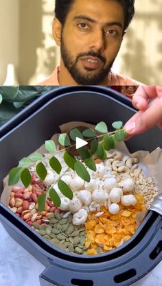 a man is holding a container with food in it