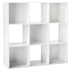 a white bookcase with six sections on one side and four shelves on the other