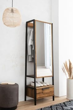 a mirror sitting on top of a wooden shelf