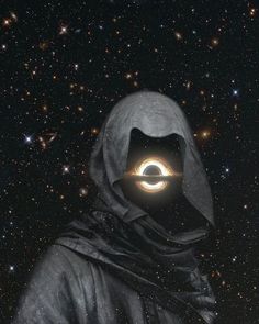 a person wearing a hooded jacket with a glowing circle in the middle of their face