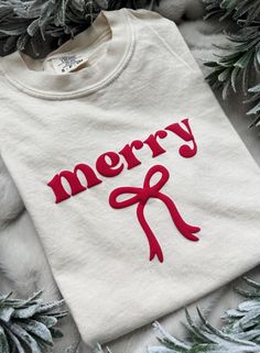 merry coquette Christmas! this simple, puff vinyl design that shows your Christmas spirit with a fem, coquette touch.  A cozy Comfort Colors tee that looks great alone or lovely under a festive cardigan!  Options to match your little one as well!! Make it a Mama & Mini look! Link below :)  https://www.etsy.com/listing/1812933652/merry-christmas-toddler-shirt-coquette  **CARE INSTRUCTIONS** to protect the longevity of the puff design, please flip item inside out. Wash on cold / delicate. Low heat Aesthetic Cricut Shirts, Cricut Vinyl Shirts Ideas, Cricut Tee Shirt Ideas, Puff Vinyl Shirt Ideas, Cricut Tshirt Ideas, Cricut Shirt Ideas, Circuit Shirts, Merry Shirt, Christmas Sweatshirt Ideas