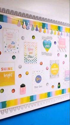 a bulletin board with lots of different types of stickers on it's side