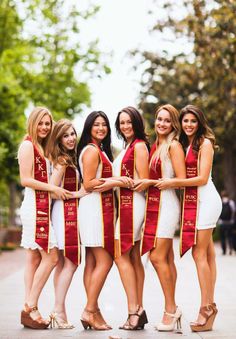 a group of women standing next to each other