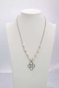 A partial pearl silver necklace with a pearl pendant elegantly combines a sleek silver chain, intermittently accented with lustrous pearls, leading to a stunning central pearl pendant. This sophisticated accessory merges the timeless beauty of pearls with the modern appeal of silver, creating a versatile piece perfect for enhancing both day and night ensembles. Length: 20” Pearl Pendant: 25.3 mm Closure: Lobster Claw Material: Brass with Silver Plating and Rhodium Coating Lead Free and Hypoaller