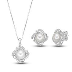 This radiant boxed set features a matching necklace and pair of earrings set in classic sterling silver. Each piece showcases a lustrous freshwater cultured pearl surrounded by a dazzling frame of white lab-created sapphires. The pendant hangs from an 18-inch cable chain and secures with a lobster clasp. Classic White Gold Jewelry Set, Classic White Gold Jewelry Set For Gifts, Classic White Gold Jewelry Sets As Gift, Classic White Gold Jewelry Set Gift, Elegant Jewelry Sets For Anniversary And Mother's Day, Elegant Formal Jewelry Sets For Mother's Day, Formal Pearl Pendant Jewelry For Mother's Day, Elegant Jewelry Sets For Mother's Day, Formal Jewelry Sets With Pearl Pendant