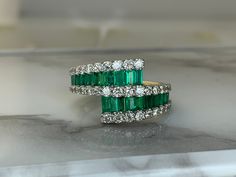 14kt yellow gold ring set with 1.60ct total weight of emeralds and accented with .95ct total weight of diamonds! Weighs 4.0dwt, is 13.6mm at its widest point and is currently a size 7.5 but can be resized! Emerald Cut Green Diamond Ring With Multi-stone, Green Emerald Cut Multi-stone Diamond Ring, Emerald Cut Green Multi-stone Diamond Ring, Cluster Emerald Ring With Vvs Clarity, Green Cluster Emerald Ring Vvs Clarity, Green Cluster Emerald Ring With Vvs Clarity, Green Emerald Cluster Ring With Diamond Accents, Unique Emerald Rings, Unique Office