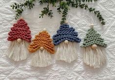 four crocheted ornaments are arranged on a quilt