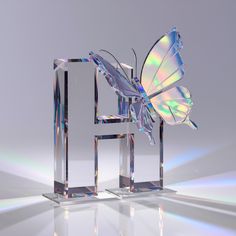 a glass sculpture with a butterfly on it