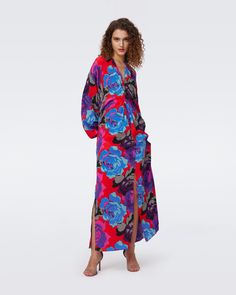 Cut from a soft silk blend, the Kason maxi dress has a relaxed yet sexy feel. This piece has long wide sleeves that cinch at the wrists, a V-neckline with knotted detail, and a full, flowing skirt.Yana is 5 Foot and 8 Inches and wearing a size XS. Wrap Dress Dvf, Midi Wrap Dress, Rose Blue, Flowing Skirt, Wrap Dress Floral, Mini Wrap Dress, Maxi Wrap Dress, Knee Length Dresses, Wide Sleeves