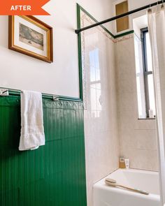 a bathroom with green tile and white walls