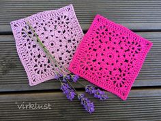 two crocheted napkins sitting on top of a wooden table