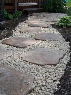 a walkway made out of rocks and gravel