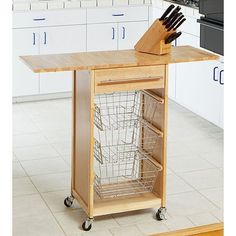 a kitchen island with baskets and knives on it