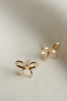 Rumor has is that 2024 is the year of BOWS! These super cute, bow stud earrings are the dainty, delicate, and prefect for all day wear. Includes two gold or silver-plated bow studs Approx. 1/2" Choose from either gold or silver Bow Tie Earrings, Only Gold Earrings, Cute Earing, New Years Earrings, Minimalist Accessories Jewellery, Everyday Wear Jewelry, Cute Stud Earrings, Bow Jewelry, Gold Earrings Designs