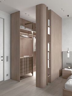 a bedroom with white walls and wooden furniture in the corner, along with an open closet