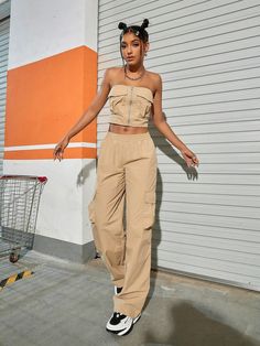 Our Tube Top And Flap Pocket Wide Leg Cargo Pants will give your everyday wardrobe a major upgrade. When it comes to style, these beige pants have you covered. With multiple pockets for pocket flaps, you’ll never be without a place to store your goodies. Whether you're on the go or kicking back, you'll be doing it in style. So step out boldly and watch those heads turn. Specifications: Style: Casual Pattern Type: Plain Details: Pocket, Ruched Bust Neckline: Strapless Top Type: Bandeau Bottom Typ Beige Utility Pants With Flap Pockets, Trendy Beige Cargo Pants With Cargo Pockets, Trendy Beige Cargo Pants With Multiple Pockets, High Waist Beige Cargo Jeans With Pockets, High-waisted Beige Cargo Pants, High Waist Beige Cargo Pants With Cargo Pockets, Beige High Waist Pants With Multiple Pockets, Trendy Beige Cargo Pants With Side Pockets, Beige High Waist Cargo Jeans