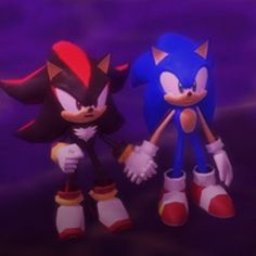 two toy sonic and tails standing next to each other in front of a purple background