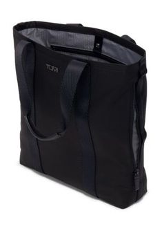 This medium-sized tote is designed to be embroidered for a personalized look. It features signature Bravo details like TUMI+ compatibility and an Add-a-Bag strap. | TUMI Alpha Bravo Essential Tote Bag, Black Tote Bag Black, Bag Straps, Medium Size, Tote Bag, Black