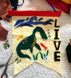 a banner that says live on it next to scissors and other crafting supplies,