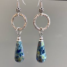 "Blue Czech Earrings - Cobalt blue with earthy Picasso finish dangle from small Antiqued Silver plated Hoops.  It was hard to capture the beauty of the Czech beads. Antiqued Silver plated Earwires The bead finish varies with each bead.  This is a stock photo. Earrings measure just over 2.25\" from top of earwires to bottom of beads." Blue Hypoallergenic Hoop Earrings, Blue Dangle Hoop Earrings, Blue Dangle Hoop Earrings Hypoallergenic, Handmade Blue Teardrop Hoop Earrings, Blue Teardrop Pendant Earrings As Gift, Blue Metal Teardrop Earrings Gift, Blue Teardrop Hypoallergenic Hoop Earrings, Blue Nickel-free Long Drop Teardrop Earrings, Blue Hypoallergenic Teardrop Hoop Earrings