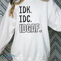 Funny Sarcastic Tee, Idk Idc Idgaf Sweatshirt, I Dont Care Sweatshirt, Funny Men Sweathirt, Funny Sassy Shirt,Sarcastic Sweatshirt,Not Today Everyone needs a cozy go-to hoodie to curl up in, so go for one that's soft, smooth, and stylish. It's the perfect choice for cooler evenings! * 50% cotton, 50% polyester  * Pre-shrunk * Unisex... Runs true to size Note: This is a unisex/relaxed fit t-shirt that are true to size. It is not a women's fitted shirt.  We recommend ordering a size down for a more feminine fit.  Also, please refer to the size chart in the listing photos. Here are my suggestions for ordering the correct sizes..  1. If you typically wear a medium and like your sweatshirts/hoodies with a loose/relaxed fit order your normal size. If you prefer a more fitted shirt order a size s Idk Idc Idgaf, Sarcastic One Liners, Sassy Shirts, Sarcastic Tees, Text Tee, Dont Care, Funny Men, Ny Fashion, Fitted Shirt