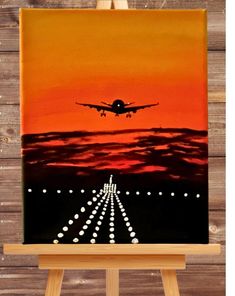 an airplane is flying in the sky over a runway with white lights on it, painted on canvas