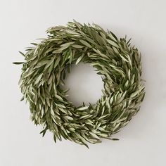 a close up of a wreath on a white surface