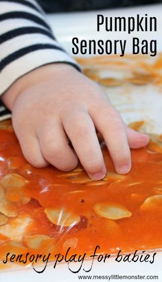 a close up of a child's hand on a plastic bag