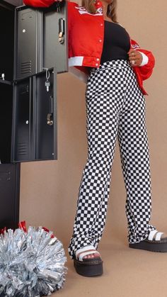 PREORDER shipping 10.1.24  Kickin' it and turning heads, this checkered pant is featured in a, relaxed high stretch fit with a black/white checkered pattern and high rise waistband for a true cool girl energy look. Checkered Pants Waistband: Elastic Fabric: 95% Polyester, 5% Spandex Elastic waistband High stretch fabrication Pockets Wide leg bottom Imported Fit: True to size! Measurements:  S: INSEAM: 32" | 13-18” WAIST | 12” RISE Model Specs: Karli is wearing a size small in the photo. How will this item fit you? Check out our MODEL SPECS (Typical Sizing - Karli: S-Size 5/26 - 5ft 2in, Emily: S-Size 3/25 - 5ft 5in, Syd: L/XL- Size 15/ - 5ft 8in)Need help with sizing? No problem! Join our VIP group on Facebook, Everyday Chic Boutique VIP Insiders to chat directly with our team and other c Checkered Pants Outfit, Checker Pants, Girl Energy, Black White Checkered, Checkered Pants, Checker Print, Everyday Chic, Elastic Fabric, Leather Outfit