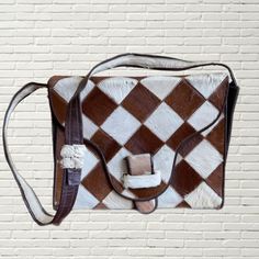 Vintage 60s Pony Hair Purse  White and Brown checkered print w pony hair fabric  structured box bag mirror inside brown leather interior long shoulder strap flaws as pictured. minimal wear to ponyhair, some creases inside Measurements: Height:9 Length:11 Width:3 Vintage Brown Rectangular Shoulder Bag For Office, Rectangular Vintage Brown Shoulder Bag For Office, Retro Vintage Brown Rectangular Shoulder Bag, Vintage Brown Rectangular Shoulder Bag With Adjustable Strap, Designer Brown Square Shoulder Bag, Retro Brown Rectangular Box Bag, Brown Retro Rectangular Box Bag, Brown Rectangular Shoulder Bag, Brown Rectangular Satchel