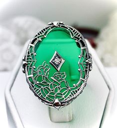 Art Deco Ring Lab Moissanite Oval Sterling Silver Filigree | Made To Order #594 Ornate Oval White Gold Filigree Ring, Elegant Oval Emerald Ring With Engraving, Elegant Oval Engraved Emerald Ring, Elegant Oval Emerald Ring Engraved, Oval Emerald Ring With Intricate Design, Victorian Oval Emerald Ring As Gift, Green Emerald Ring With Intricate Design, Green Oval Emerald Ring With Intricate Design, Oval Green Emerald Ring With Intricate Design