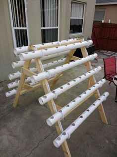 a large white pipe rack sitting in front of a house